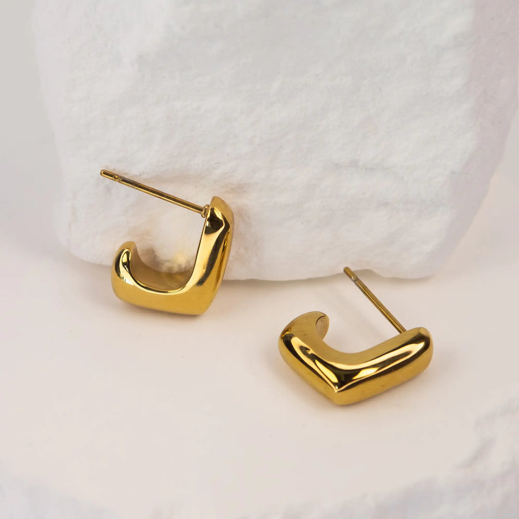 Solène Sculptural Huggie Earrings gold stainless steel — Tamola Jewellery