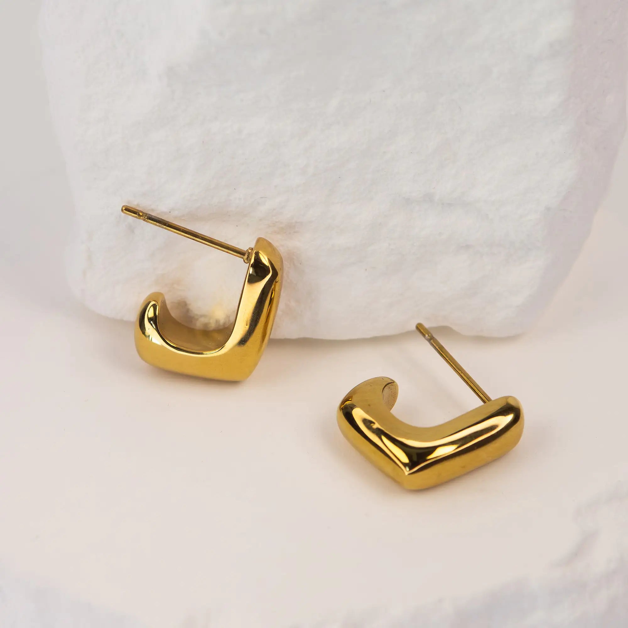 Solène Sculptural Huggie Earrings gold stainless steel — Tamola Jewellery
