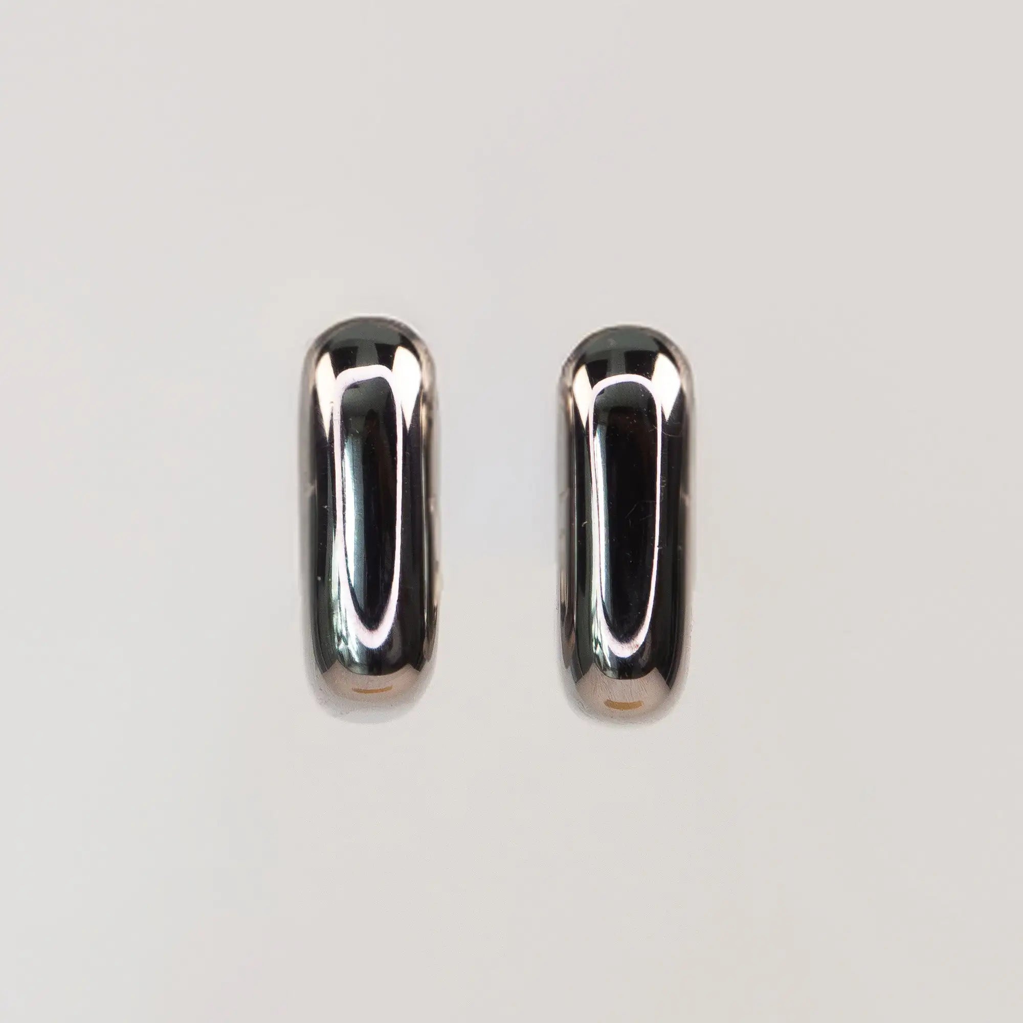 Solene Sculptural Huggie Earrings silver side view — Tamola Jewellery